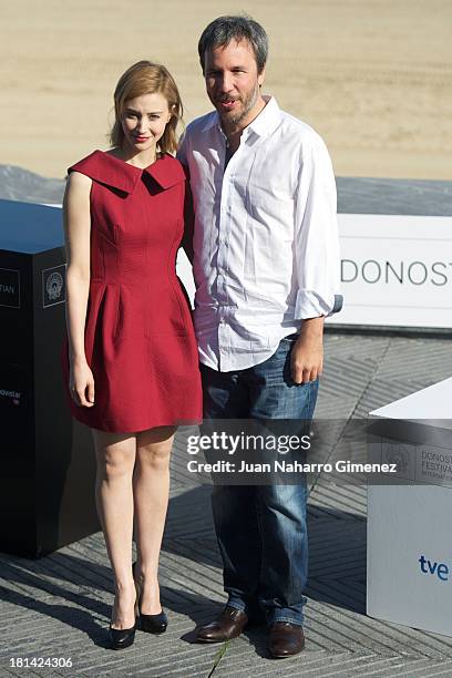 Canadian actress Sarah Gadon and Denis Villeneuve attend 'Enemy' photocall at Kursaal on September 21, 2013 in San Sebastian, Spain.