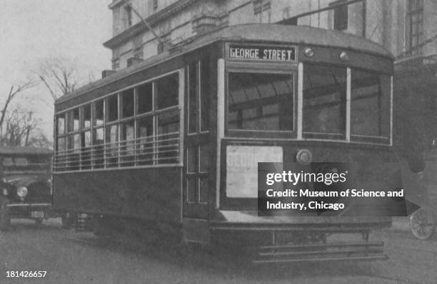 Black and white photograph of a Safety Car, Number 2212, which is servicing what was considered to be one of the Best Residential Districts, going...