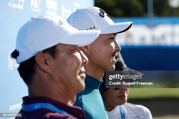 Min Woo Lee of Australia poses with his parents Soonam and Clara Lee after victory during day four of the 2023 Australian PGA Championship at Royal...