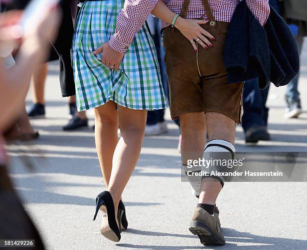 Revellers dressed in traditional Bavarian clothing attend the Oktoberfest on September 21, 2013 in Munich, Germany. The Munich Oktoberfest, which...