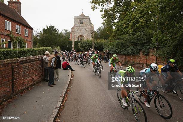 Riders pass through the small village of Puttenham during stage seven of the Tour of Britain from Epsom Racecourse to Guildford on September 21, 2013...