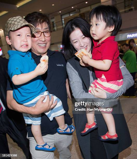 South Korean actress Lee Young-Ae, her husband Jung Ho-Young and their fraternal twins are seen at Incheon International Airport on September 20,...
