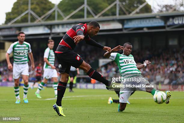 Matt Phillips of Queens Park Rangers shoots as Joel Grant of Yeovil Town blocks during the Sky Bet Championship match between Yeovil Town and Queens...