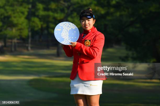 Miyuu Yamashita of Japan poses with the Ricoh Cup after winning the tournament following the final round of JLPGA Tour Championship Ricoh Cup at...