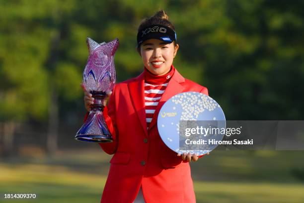 Miyuu Yamashita of Japan poses with the JLPGA Tour Championship trophy and Ricoh Cup after winning the tournament following the final round of JLPGA...