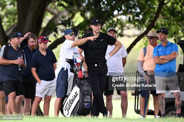 Cam Davis of Australia and caddie Andrew Tschudin prepare to play a shot during day four of the 2023 Australian PGA Championship at Royal Queensland...