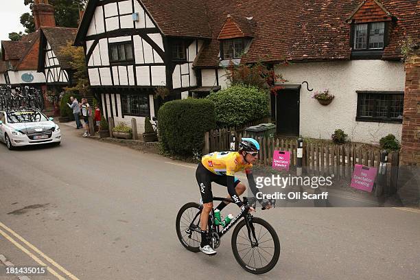 Race leader Sir Bradley Wiggins passes through the small village of Shere during stage seven of the Tour of Britain from Epsom Racecourse to...