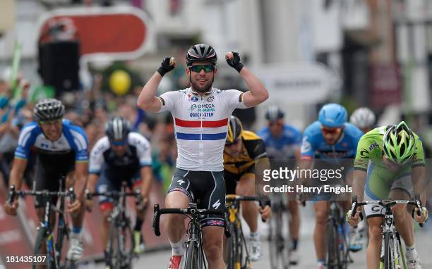 Mark Cavendish of Great Britain and Omega Pharma Quick-Step celebrates winning stage seven of the Tour of Britain from Epsom to Guildford on...
