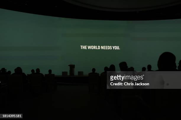 The words "The World Needs You" are projected on screen at the opening ceremony of the World Climate Action Summit during COP28 on December 01, 2023...
