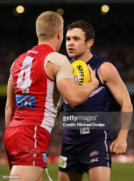 Hayden Ballantyne of the Dockers and Daniel Hannebery of the Swans face off during the AFL Second Preliminary Final match between the Fremantle...
