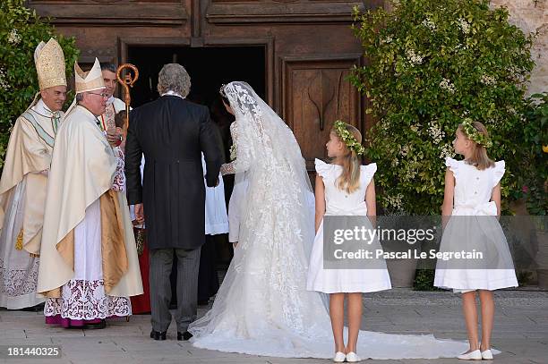 Princess Claire Of Luxembourg and her father Hartmut Lademacher are greeted by Most Reverend Jean-Claude Hollerich, Archbishop of Luxembourg,...