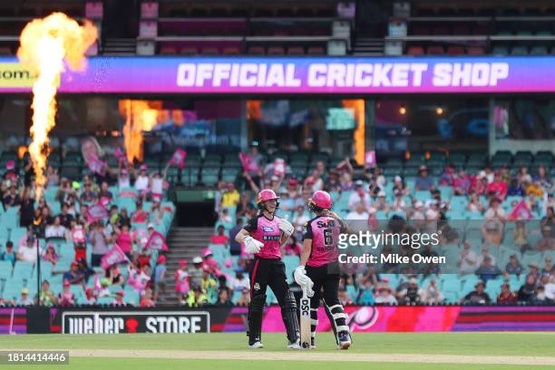 Ellyse Perry and Ashleigh Gardner of the Sixers celebrate victory following the WBBL match between Sydney Sixers and Sydney Thunder at Sydney Cricket...