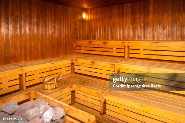 wooden steam sauna in a luxury resort with no people - sauna stockfoto's en -beelden