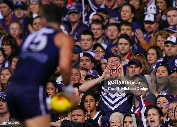 Dockers fan reacts when Ryan Crowley of the Dockers grabs the ball during the AFL Second Preliminary Final match between the Fremantle Dockers and...