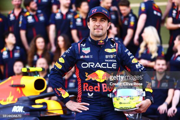 Sergio Perez of Mexico and Oracle Red Bull Racing poses at the Red Bull Racing Team Photo prior to the F1 Grand Prix of Abu Dhabi at Yas Marina...