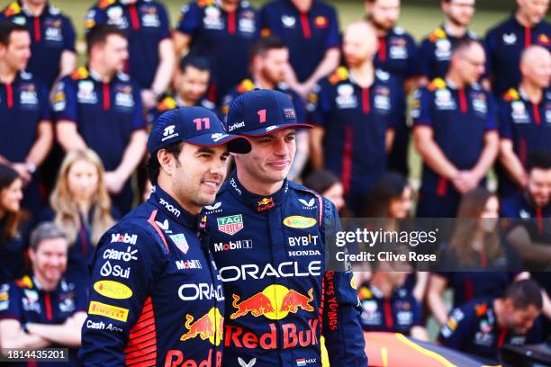 Max Verstappen of the Netherlands and Oracle Red Bull Racing and Sergio Perez of Mexico and Oracle Red Bull Racing talk at the Red Bull Racing Team...