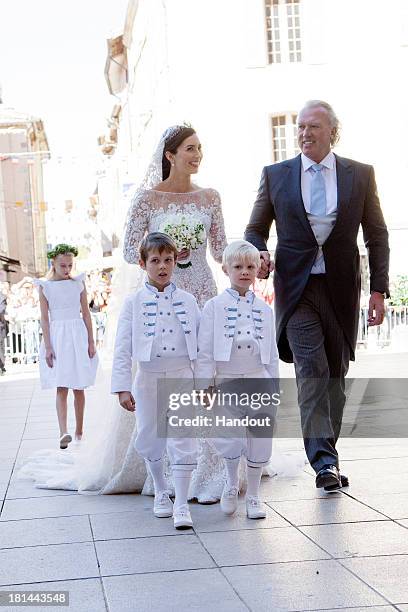 In this handout image provided by the Grand-Ducal Court of Luxembourg, Princess Claire Of Luxembourg, her father Hartmut Lademacher, Prince Noah Of...