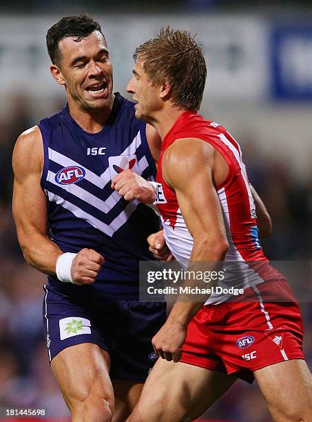 Ryan Crowley of the Dockers celebrates a goal next to Kieran Jack of the Swans during the AFL Second Preliminary Final match between the Fremantle...