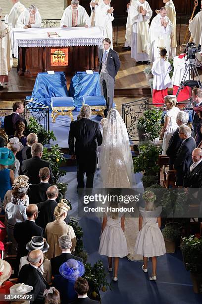 In this handout image provided by the Grand-Ducal Court of Luxembourg, Princess Claire Of Luxembourg and her father Hartmut Lademacher walk towards...