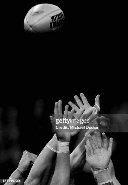 Players hands contest for the ball during the AFL Second Preliminary Final match between the Fremantle Dockers and the Sydney Swans at Patersons...