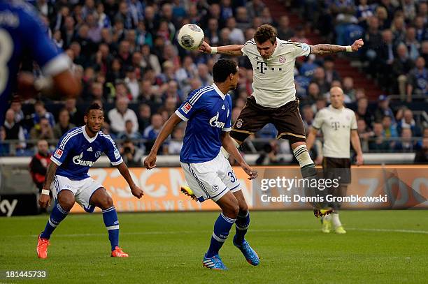 Mario Mandzukic of Bayern Muenchen heads his team's second goal during the Bundesliga match between FC Schalke 04 and FC Bayern Muenchen at...