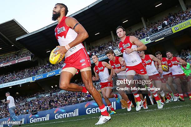 Lewis Jetta of the Swans leads the team out during the AFL Second Preliminary Final match between the Fremantle Dockers and the Sydney Swans at...