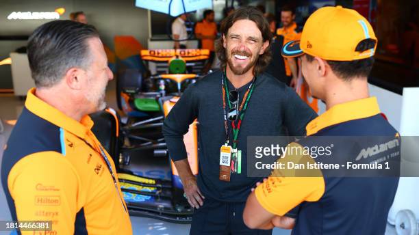McLaren Chief Executive Officer Zak Brown, Lando Norris of Great Britain and McLaren and Tommy Fleetwood talk in the Paddock prior to the F1 Grand...