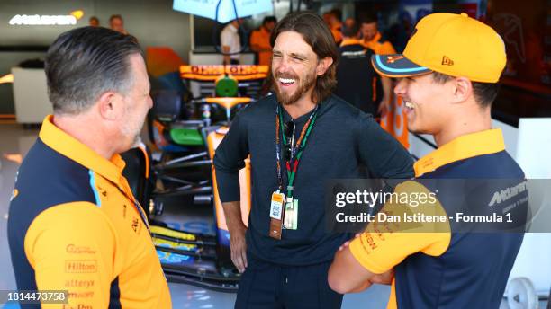 McLaren Chief Executive Officer Zak Brown, Lando Norris of Great Britain and McLaren and Tommy Fleetwood talk in the Paddock prior to the F1 Grand...