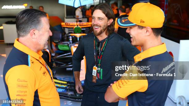 McLaren Chief Executive Officer Zak Brown, Lando Norris of Great Britain and McLaren and Tommy Fleetwood talk in the Paddock prior to the F1 Grand...