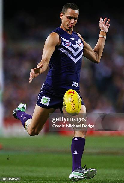 Michael Johnson of the Dockers kicks the ball during the AFL Second Preliminary Final match between the Fremantle Dockers and the Sydney Swans at...