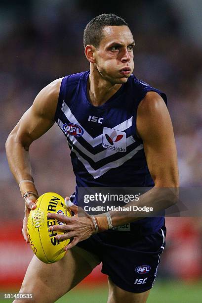 Michael Johnson of the Dockers looks ahead with the ball during the AFL Second Preliminary Final match between the Fremantle Dockers and the Sydney...