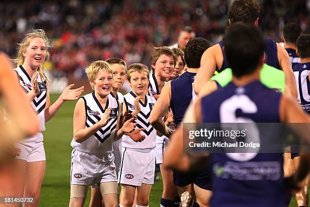 Dockers fans show their support for the players at half time during the AFL Second Preliminary Final match between the Fremantle Dockers and the...
