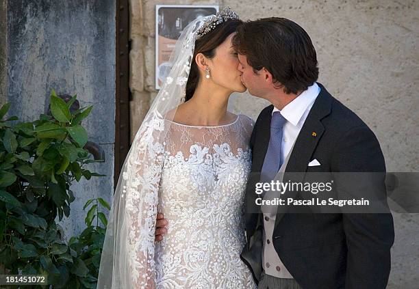 Princess Claire Of Luxembourg and Prince Felix Of Luxembourg kiss as they depart from their wedding ceremony at the Basilique Sainte Marie-Madeleine...