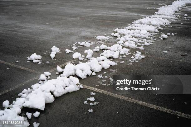 a trace of snow on concrete ground - slushy texture stock pictures, royalty-free photos & images