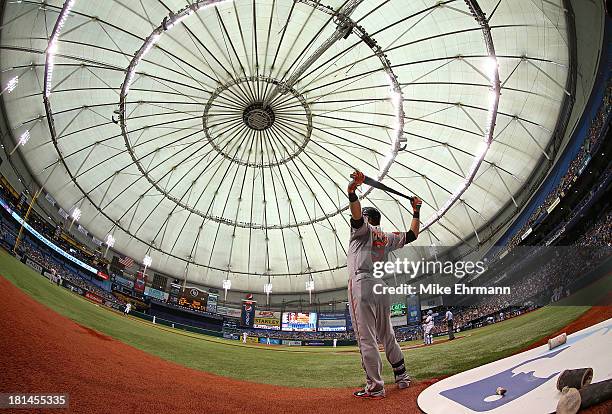 Nate McLouth of the Baltimore Orioles stretches before an at bat during a game against the Tampa Bay Rays at Tropicana Field on September 21, 2013 in...