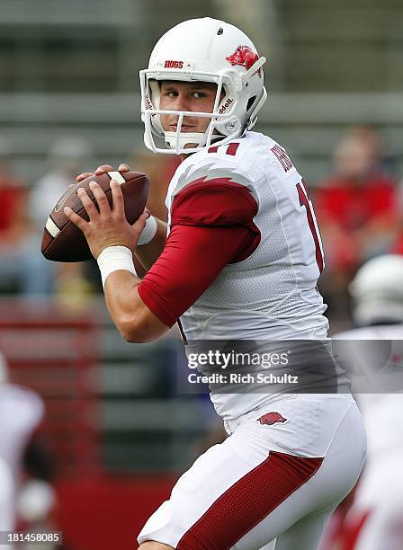 Quarterback AJ Derby of the Arkansas Razorbacks passes during a pre game drill before a game against the Rutgers Scarlet Knights at High Point...