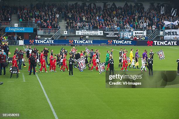 Opkomst spelers during the Eredivisie match between Heracles Almelo and FC Twente on September 21, 2013 at the Polman stadium at Almelo, The...