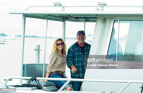 Alexis Roderick and Billy Joel attend Friends Of The Bay Cleanup at Theodore Roosevelt Park on September 21, 2013 in Oyster Bay, New York.