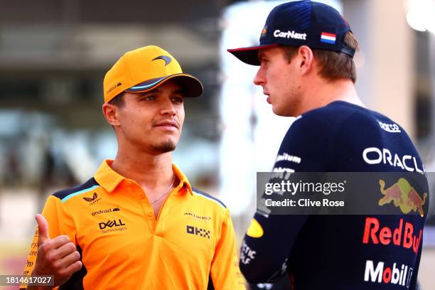 Lando Norris of Great Britain and McLaren and Max Verstappen of the Netherlands and Oracle Red Bull Racing talk on the drivers parade prior to the F1...