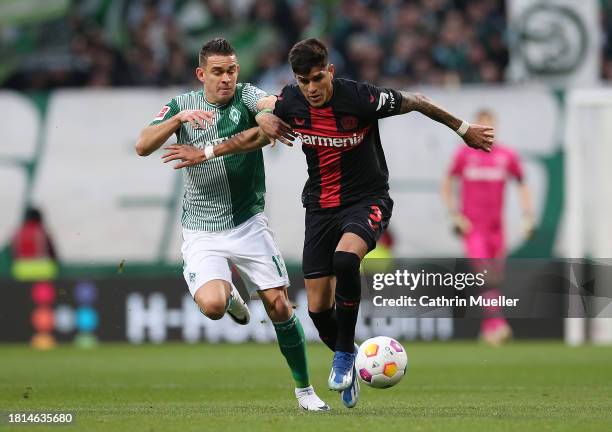 Piero Hincapie of Bayer 04 Leverkusen is challenged by Rafael Borre of Werder Bremen during the Bundesliga match between SV Werder Bremen and Bayer...