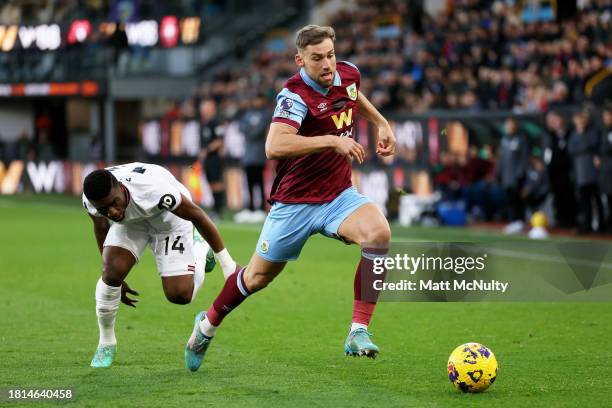 Charlie Taylor of Burnley battles for possession with Mohammed Kudus of West Ham United during the Premier League match between Burnley FC and West...