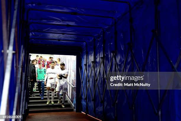 Lucas Paqueta and Emerson Palmieri of West Ham United emerge from the tunnel for the second half during the Premier League match between Burnley FC...