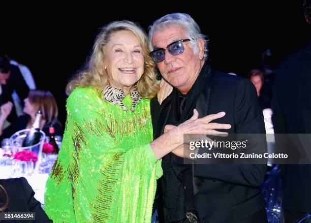 Marta Marzotto and Roberto Cavalli attend the amfAR Milano 2013 Gala Dinner as part of Milan Fashion Week Womenswear Spring/Summer 2014 at La...