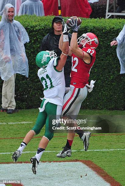 Kenny Buyers of the North Texas Mean Green breaks up a pass against Michael Bennett of the Georgia Bulldogs at Sanford Stadium on September 21, 2013...