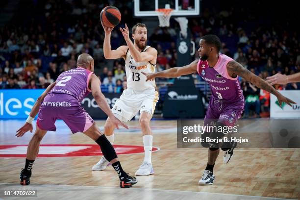 Sergio Rodriguez of Real Madrid and Markel Starks and Jean Montero of Morabanc Andorra in action during ACB League match between Real Madrid and...