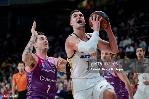 Mario Hezonja of Real Madrid and Juan Rubio of Morabanc Andorra in action during ACB League match between Real Madrid and Morabanc Andorra at WiZink...