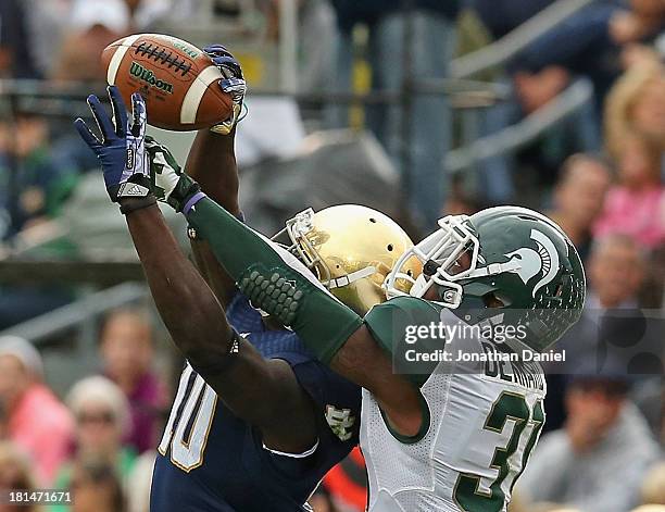 Darqueze Dennard of the Michigan State Spartans breaks up a pass intended for DeVarius Daniels of the Notre Dame Fighting Irish at Notre Dame Stadium...