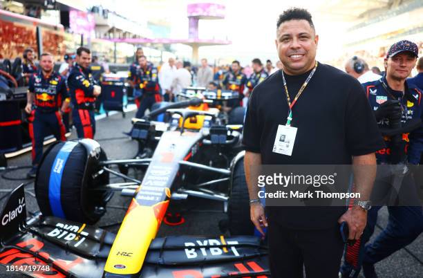 Ronaldo poses for a photo with the car of Max Verstappen of the Netherlands and Oracle Red Bull Racing on the grid prior to the F1 Grand Prix of Abu...