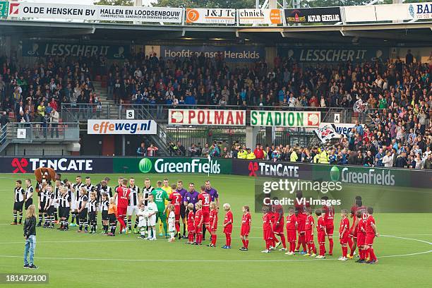 Opkomst spelers during the Eredivisie match between Heracles Almelo and FC Twente on September 21, 2013 at the Polman stadium at Almelo, The...
