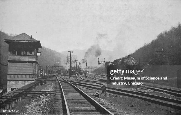 Photograph of a railroad junction on the Baltimore and Ohio railroad, showing the R Tower at M and K Junction, which is the busiest fueling station,...